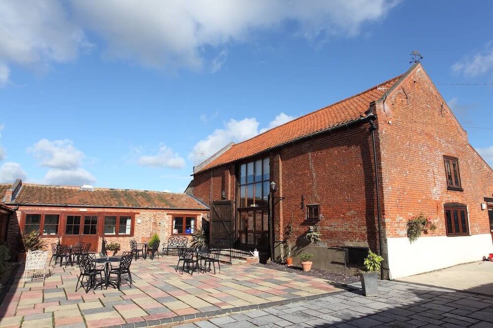 Dairy Barns Bed & Breakfast exterior in Norfolk countryside.